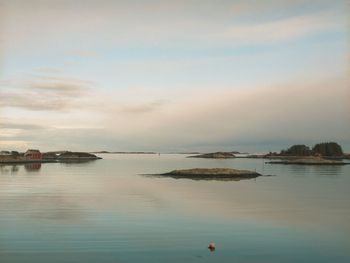 Scenic view of bay against sky