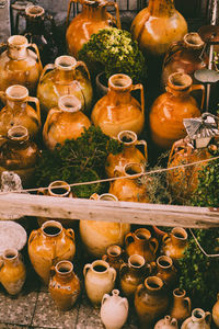 High angle view of clay pots at market for sale