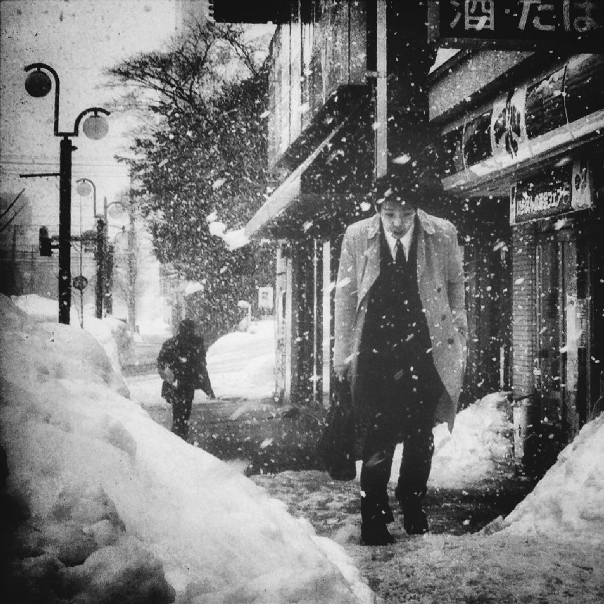 men, building exterior, lifestyles, street, walking, winter, built structure, full length, architecture, rear view, cold temperature, snow, city, leisure activity, city life, person, season, transportation