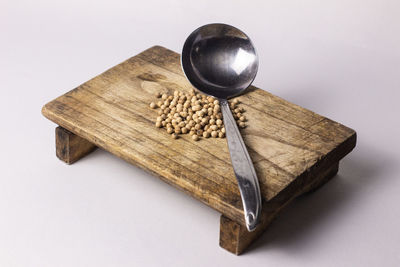 High angle view of bread on table against white background