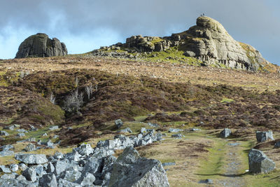 Low angle view of cliff against sky
