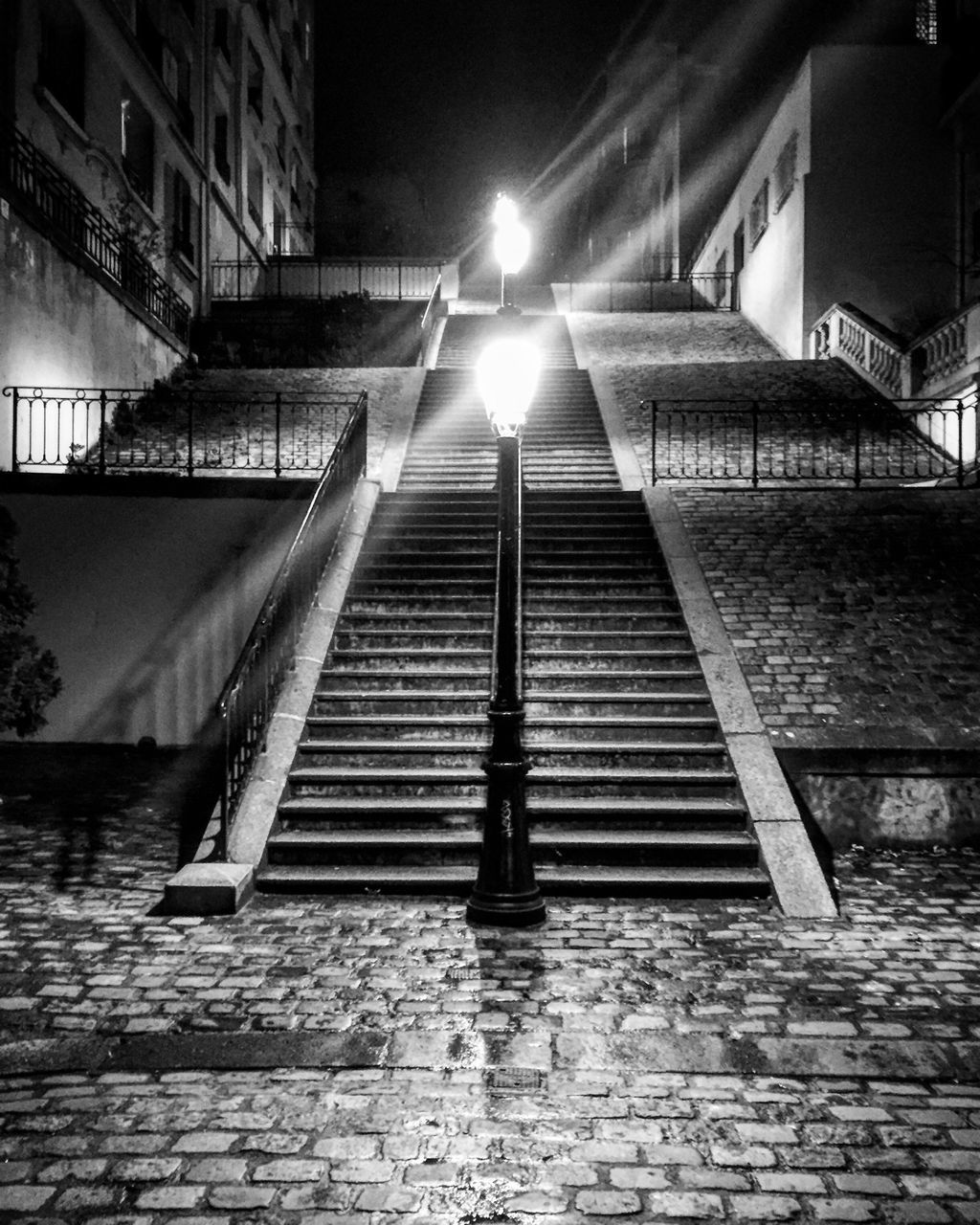 architecture, built structure, building exterior, night, illuminated, low angle view, building, city, brick wall, residential building, lighting equipment, residential structure, no people, street light, outdoors, steps, wall - building feature, the way forward, steps and staircases, sunlight