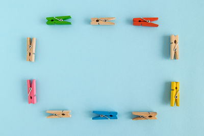 High angle view of toys on table against blue background