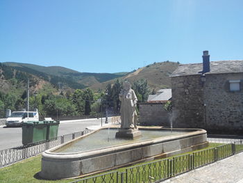 View of mountain range against blue sky