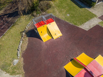 High angle view of yellow flag on footpath