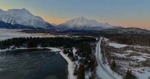 Panoramic view of snowcapped mountains against sky during winter