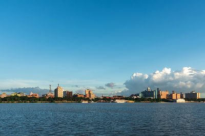 Sea with buildings in background