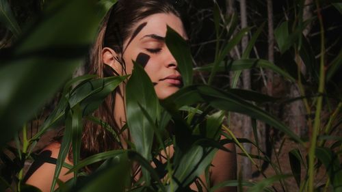 Portrait of young woman looking away