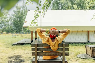 Portrait of woman sitting on bench