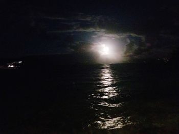 Scenic view of sea against sky at night