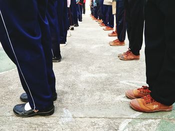 Low section of people standing on floor