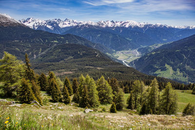 Scenic view of snowcapped mountains against sky