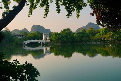 Arch bridge over lake against sky in rong and shan lake