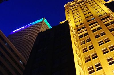 Low angle view of illuminated building at night