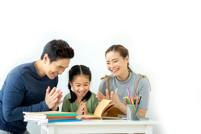 Two people sitting on table