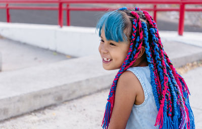 Portrait of smiling girl looking away