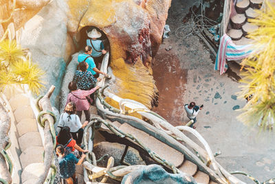 High angle view of people on rock