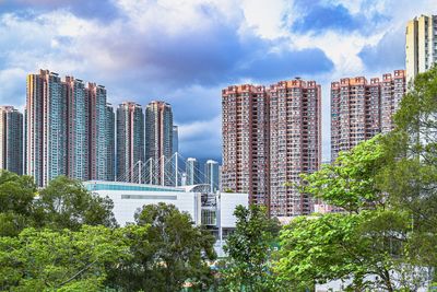 Skyscrapers in city against sky