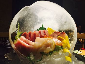 Close-up of fresh meal served in ice bowl at restaurant