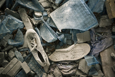 Abandoned shoes and shattered glass