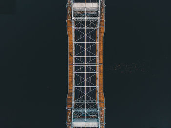 Low angle view of illuminated tower against sky at night