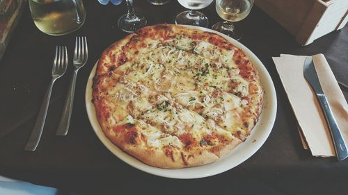 High angle view of pizza served on table