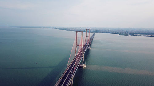 High angle view of bridge over sea against sky