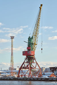 Massive harbor cranes in seaport. heavy load dockside cranes in port, cargo container ship terminal