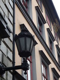 Low angle view of street light against building