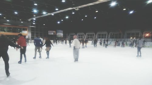 People walking on snow covered field