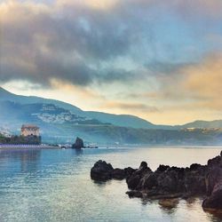 Scenic view of sea against cloudy sky