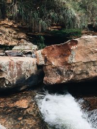 View of river flowing through rocks