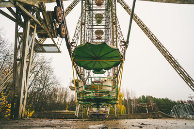 Low angle view of ferris wheel against sky