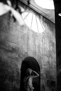 Statue of buddha against wall