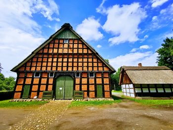 House on field against sky