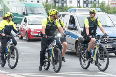 People riding bicycles on road