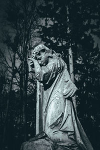Statue of buddha against trees