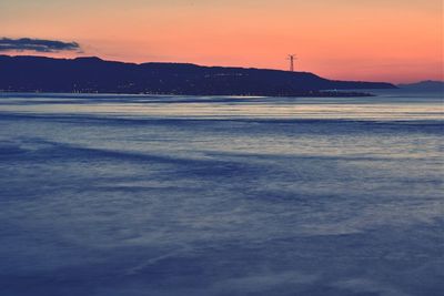 View of sea against cloudy sky during sunset