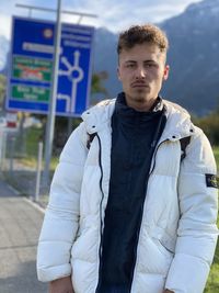 Portrait of young man standing outdoors