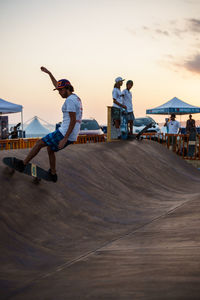 People skateboarding at park