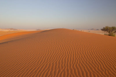 Scenic view of desert against clear sky