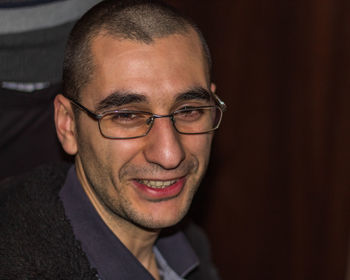 Close-up portrait of a smiling young man