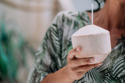 Close-up of woman holding drink