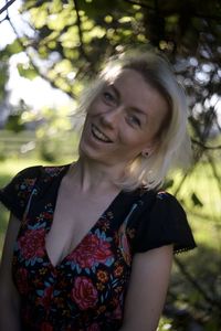 Portrait of young woman standing outdoors