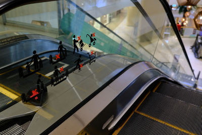 High angle view of people on escalator