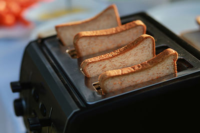 High angle close-up of bread in toaster