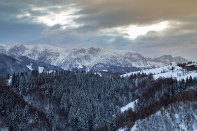 Scenic view of snowcapped mountains against sky