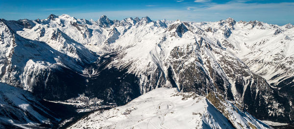 Mountain valley with snow and sky