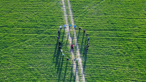 High angle view of players playing on grassy field