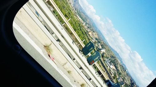 Aerial view of city against sky